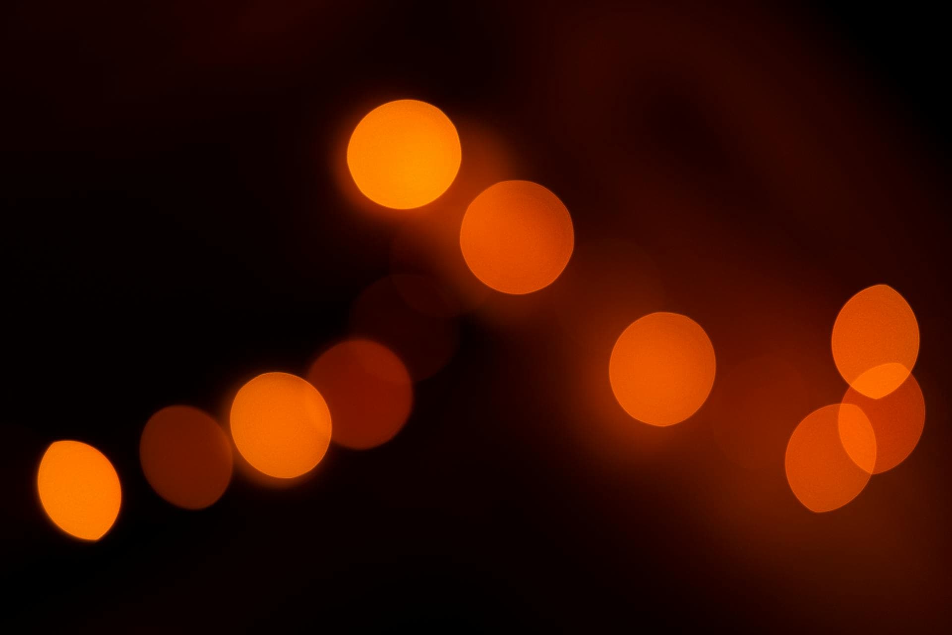 Abstract amber light particles representing knowledge and insights